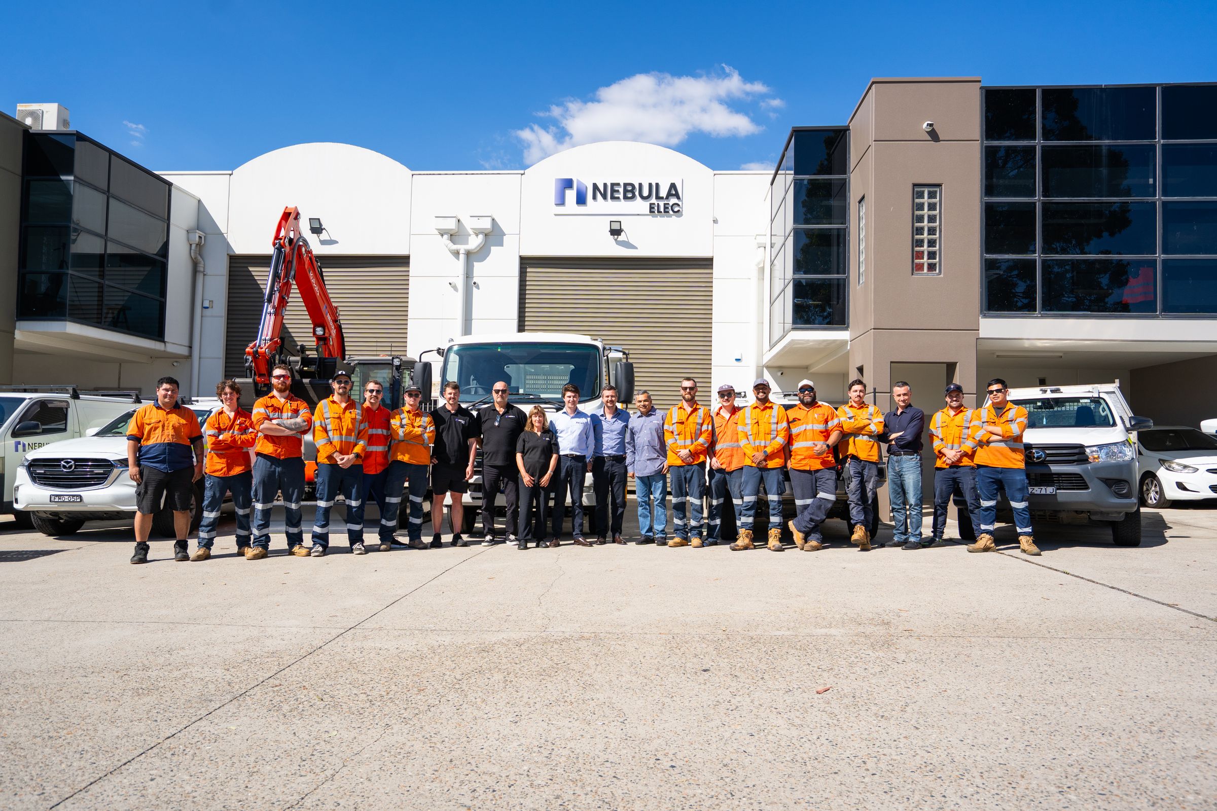 The Nebula team, more than sixty people, lined up in front of the Wetherill Park headquarters with the fleet